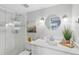 Bathroom boasts a glass-enclosed shower and a contemporary vanity with plants at 17035 Gulf Blvd # 202, North Redington Beach, FL 33708