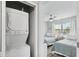 Bedroom and laundry room combination includes a stacked washer and dryer at 17035 Gulf Blvd # 202, North Redington Beach, FL 33708
