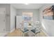 Bright dining area featuring a round table with seating for four and natural light from a window at 17035 Gulf Blvd # 202, North Redington Beach, FL 33708