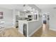 Modern kitchen with white cabinetry, stainless steel appliances, and a convenient breakfast bar at 17035 Gulf Blvd # 202, North Redington Beach, FL 33708