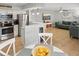 Open living space featuring stainless steel appliances, a modern kitchen, and comfortable seating area at 17035 Gulf Blvd # 202, North Redington Beach, FL 33708
