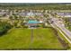 Aerial view of community featuring a pool, playground and green spaces at 1706 Trailwater St, Ruskin, FL 33570