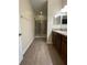 Bathroom featuring tiled floor, glass-enclosed shower, and vanity with wood cabinets at 1706 Trailwater St, Ruskin, FL 33570