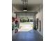 Spacious garage offering plenty of storage and work space with an open garage door at 1706 Trailwater St, Ruskin, FL 33570