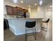 Inviting kitchen with breakfast bar, stainless steel appliances, and ample cabinet space at 1706 Trailwater St, Ruskin, FL 33570