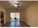 Bright living room featuring sliding glass doors leading to the outdoor patio at 1706 Trailwater St, Ruskin, FL 33570