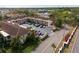 Aerial view of the multi-Gathering building showcasing the lush landscaping and parking area at 19029 Us Highway 19 N # 2-12, Clearwater, FL 33764