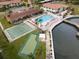 Aerial view of community pool, shuffleboard, putting green and waterfront access at 19029 Us Highway 19 N # 2-12, Clearwater, FL 33764