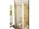 Compact bathroom features a shower/tub combo and updated shelving at 19029 Us Highway 19 N # 2-12, Clearwater, FL 33764