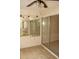 The bedroom has tile flooring and sliding glass doors leading outside at 19029 Us Highway 19 N # 2-12, Clearwater, FL 33764