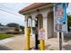 Community entry gate with a call box and security camera at 19029 Us Highway 19 N # 2-12, Clearwater, FL 33764