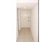 Clean hallway featuring tile flooring and neutral paint for a modern feel at 19029 Us Highway 19 N # 2-12, Clearwater, FL 33764