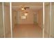 Spacious living room with ceiling fan, tile flooring, and a breakfast bar pass-through at 19029 Us Highway 19 N # 2-12, Clearwater, FL 33764