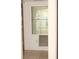 View of a bright room with a decorative mirrored wall shelf at 19029 Us Highway 19 N # 2-12, Clearwater, FL 33764