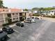Spacious parking lot with ample parking for residents and visitors in this multi-Gathering building at 19029 Us Highway 19 N # 2-12, Clearwater, FL 33764