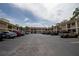 Exterior shot of community parking lot with multiple parked cars at 19029 Us Highway 19 N # 2-12, Clearwater, FL 33764