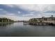 Scenic water view featuring a wooden dock and low-rise buildings at 19029 Us Highway 19 N # 2-12, Clearwater, FL 33764
