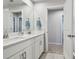 Bright bathroom featuring double sink vanity with white cabinets and stylish fixtures at 19398 Great Intention Way, Lutz, FL 33558