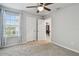 Bright bedroom with a window and plush carpeting at 19398 Great Intention Way, Lutz, FL 33558