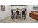 Modern kitchen with stainless steel appliances, white cabinetry, and a stylish backsplash at 19398 Great Intention Way, Lutz, FL 33558