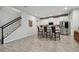 Eat-in kitchen featuring white cabinets, granite counters, stainless appliances and a large island with seating at 19398 Great Intention Way, Lutz, FL 33558