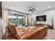 Relaxing living room featuring a large sliding glass door to the patio at 19398 Great Intention Way, Lutz, FL 33558