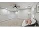 Spacious loft area with neutral carpet, a comfortable couch, and ample natural light at 19398 Great Intention Way, Lutz, FL 33558