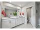 Elegant main bathroom features dual sinks, large mirror and separate toilet room at 19398 Great Intention Way, Lutz, FL 33558