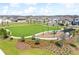 A sprawling green community park with playground equipment for Gathering fun at 19398 Great Intention Way, Lutz, FL 33558