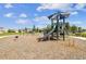 A well-maintained playground featuring swings, slides, and climbing structures for active play in a Gathering-friendly community at 19398 Great Intention Way, Lutz, FL 33558