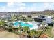 A stunning community pool with lounge chairs and palm trees at 19398 Great Intention Way, Lutz, FL 33558