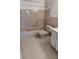 Cozy bathroom with a tub and shower combo, a white sink and neutral tile at 2402 Ecuadorian Way # 20, Clearwater, FL 33763