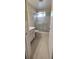Well-lit bathroom equipped with a shower, sliding glass doors, and neutral cabinets at 2402 Ecuadorian Way # 20, Clearwater, FL 33763
