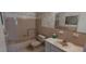 Cozy bathroom with a tub and shower combo, a white sink and floral wallpaper at 2402 Ecuadorian Way # 20, Clearwater, FL 33763