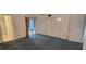 Bright bedroom features closet, a bathroom entrance, neutral walls, and soft carpet at 2402 Ecuadorian Way # 20, Clearwater, FL 33763