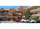 Exterior view of the building featuring balconies and lush trees in front at 2402 Ecuadorian Way # 20, Clearwater, FL 33763