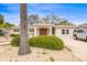 Inviting home featuring a double door entrance, meticulous landscaping, and a driveway with ample parking at 2490 E Vina Del Mar Blvd, St Pete Beach, FL 33706