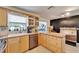 Well-maintained kitchen with modern appliances and great lighting at 2533 Limewood Dr, Holiday, FL 34690