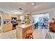Traditional kitchen with stainless steel appliances, tile flooring and center island at 2533 Limewood Dr, Holiday, FL 34690