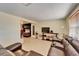 Bright living room featuring tile floors, a TV, and a comfortable sofa at 2533 Limewood Dr, Holiday, FL 34690