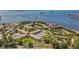 This aerial shot showcases Mediterranean Manors complex with stunning waterfront views and lush landscaping at 2700 Bayshore Blvd # 588, Dunedin, FL 34698