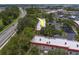 An aerial view reveals community surrounded by lush trees and nearby waterfronts at 2700 Bayshore Blvd # 588, Dunedin, FL 34698