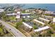 Aerial view of a townhome community with well-maintained grounds and convenient access to nearby roads and waterfront at 2700 Bayshore Blvd # 588, Dunedin, FL 34698