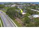 An aerial view shows mature trees, proximity to the bay and nearby beaches at 2700 Bayshore Blvd # 588, Dunedin, FL 34698
