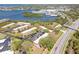 Aerial view of townhomes nestled near a beautiful bay area, showcasing its prime waterfront location and community layout at 2700 Bayshore Blvd # 588, Dunedin, FL 34698