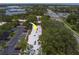 Aerial view shows ample parking, mature trees, and proximity to the bay at 2700 Bayshore Blvd # 588, Dunedin, FL 34698