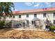 Backyard featuring a patio area with outdoor furniture and privacy fencing, offering a comfortable outdoor retreat at 2700 Bayshore Blvd # 588, Dunedin, FL 34698