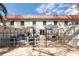 A fenced-in backyard with a patio, seating areas, and a well-maintained exterior, perfect for outdoor enjoyment at 2700 Bayshore Blvd # 588, Dunedin, FL 34698
