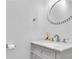 Elegant bathroom with a white marble vanity and a decorative, ornate mirror at 2700 Bayshore Blvd # 588, Dunedin, FL 34698