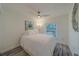 Light-filled bedroom with a ceiling fan and wood-look floors, with bright natural light at 2700 Bayshore Blvd # 588, Dunedin, FL 34698